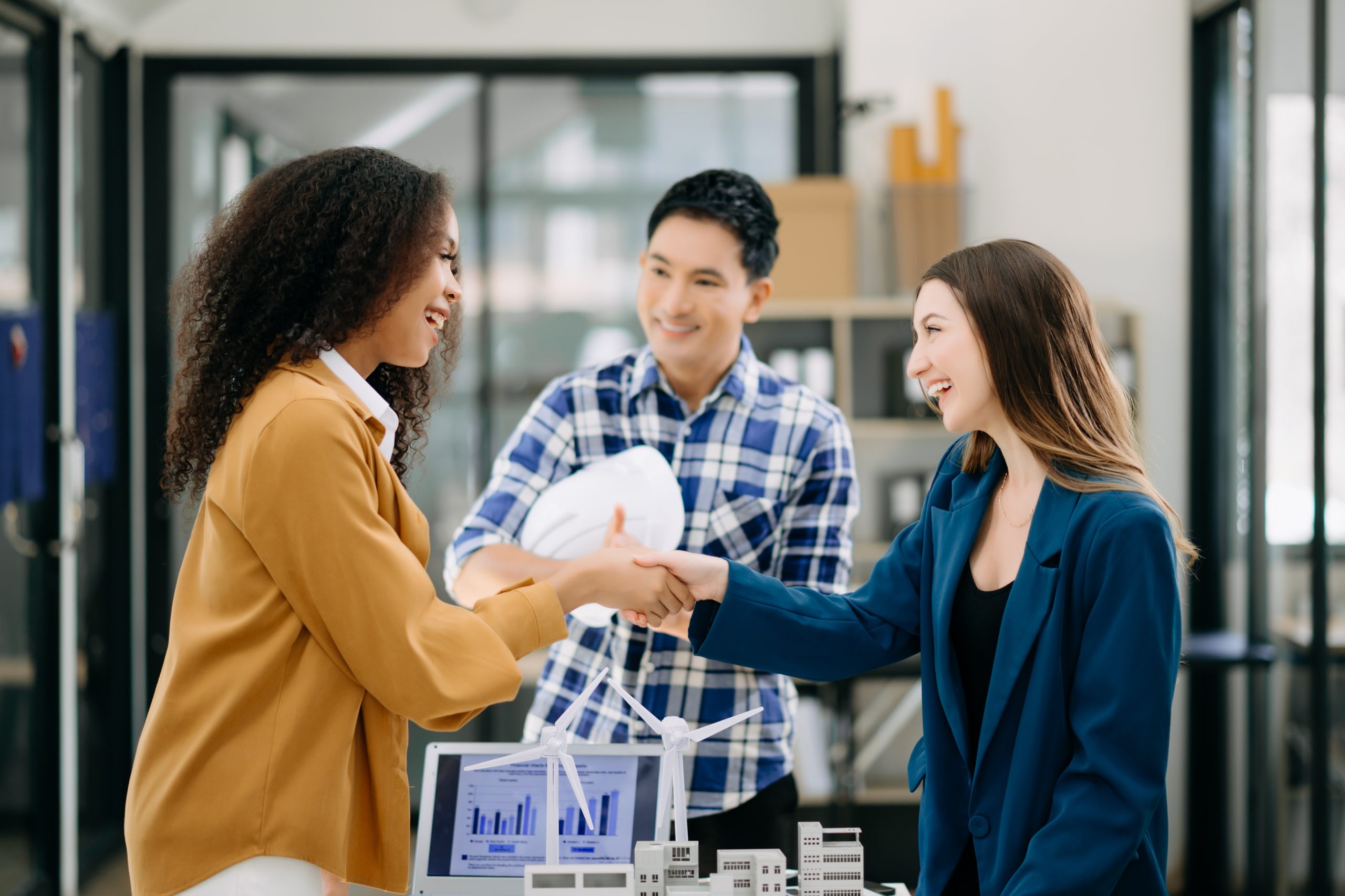 business people shaking hands during a meeting in office for B2B customer retention