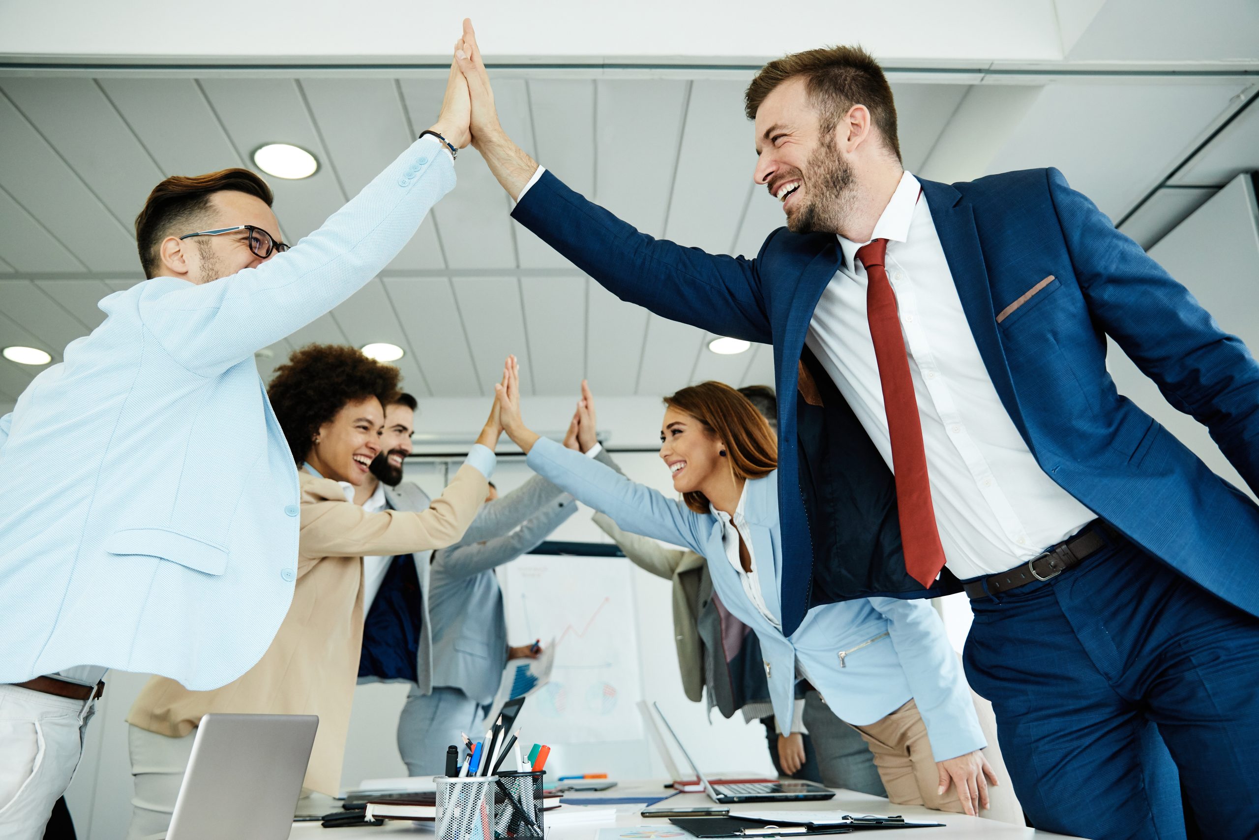 young business people meeting office teamwork group success corporate high five together for Non-Monetary Incentives