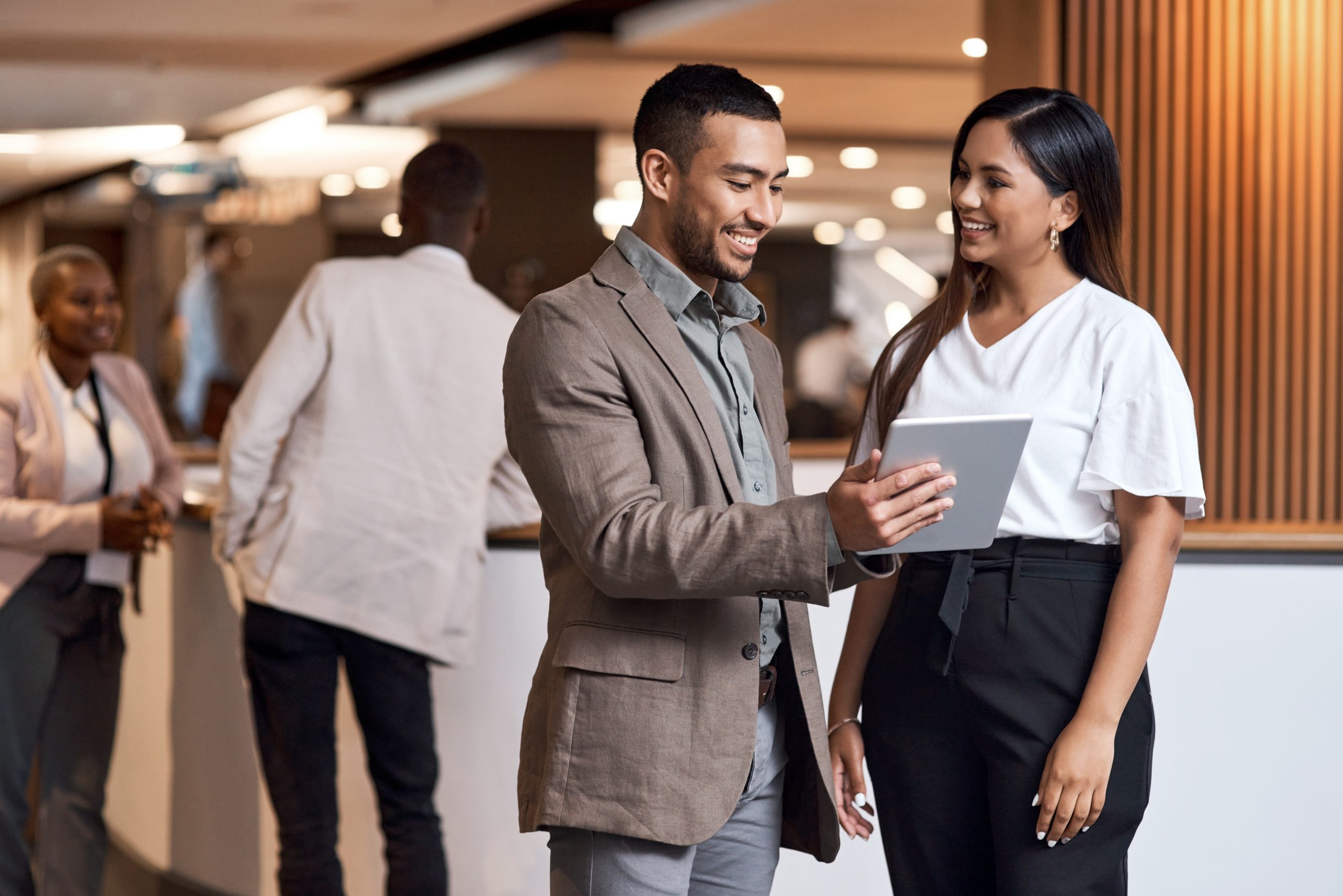 Young man and women having meeting of B2B loyalty initiatives