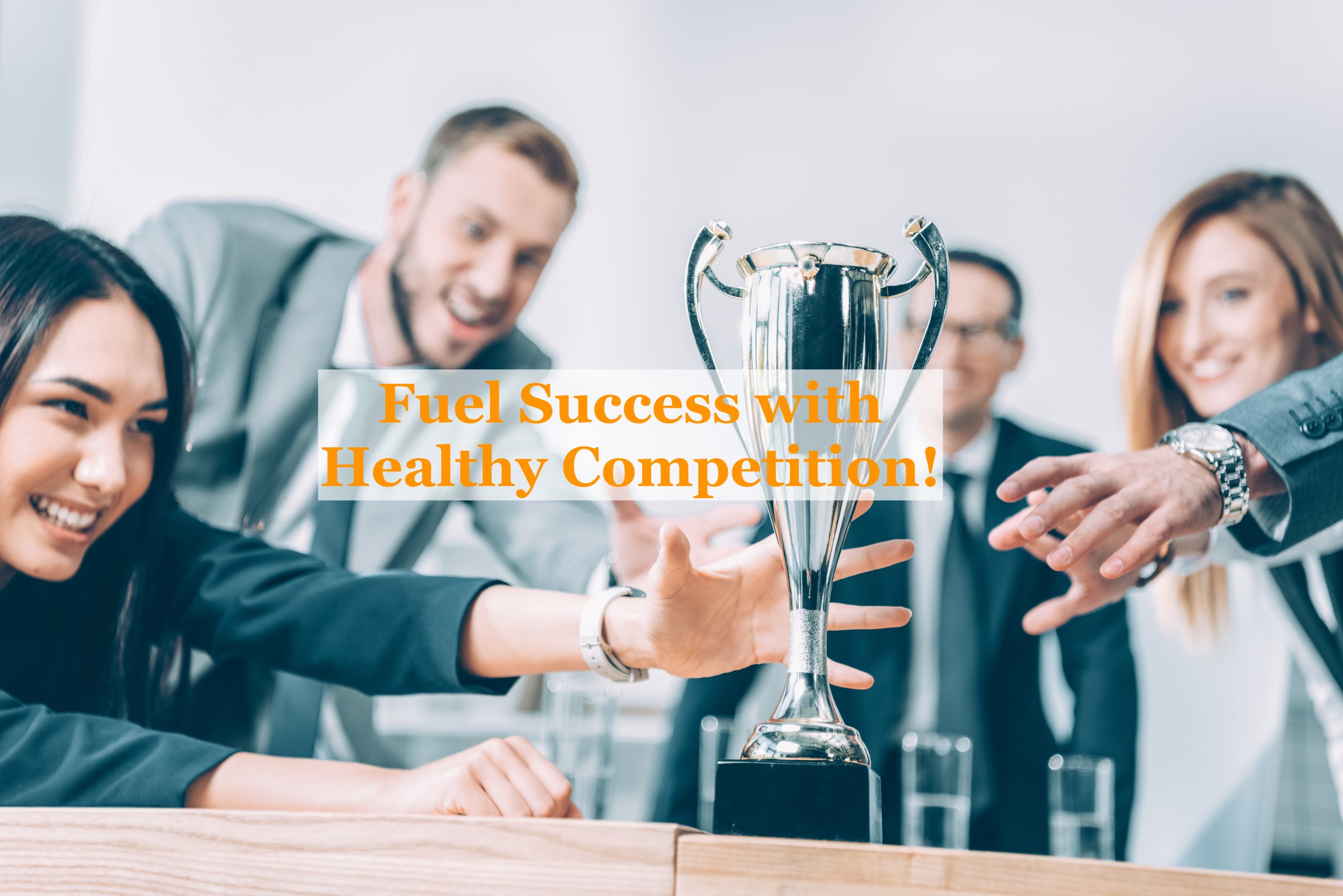 close-up shot of multiracial businesspeople trying to catch champion cup showing healthy competition in workplace