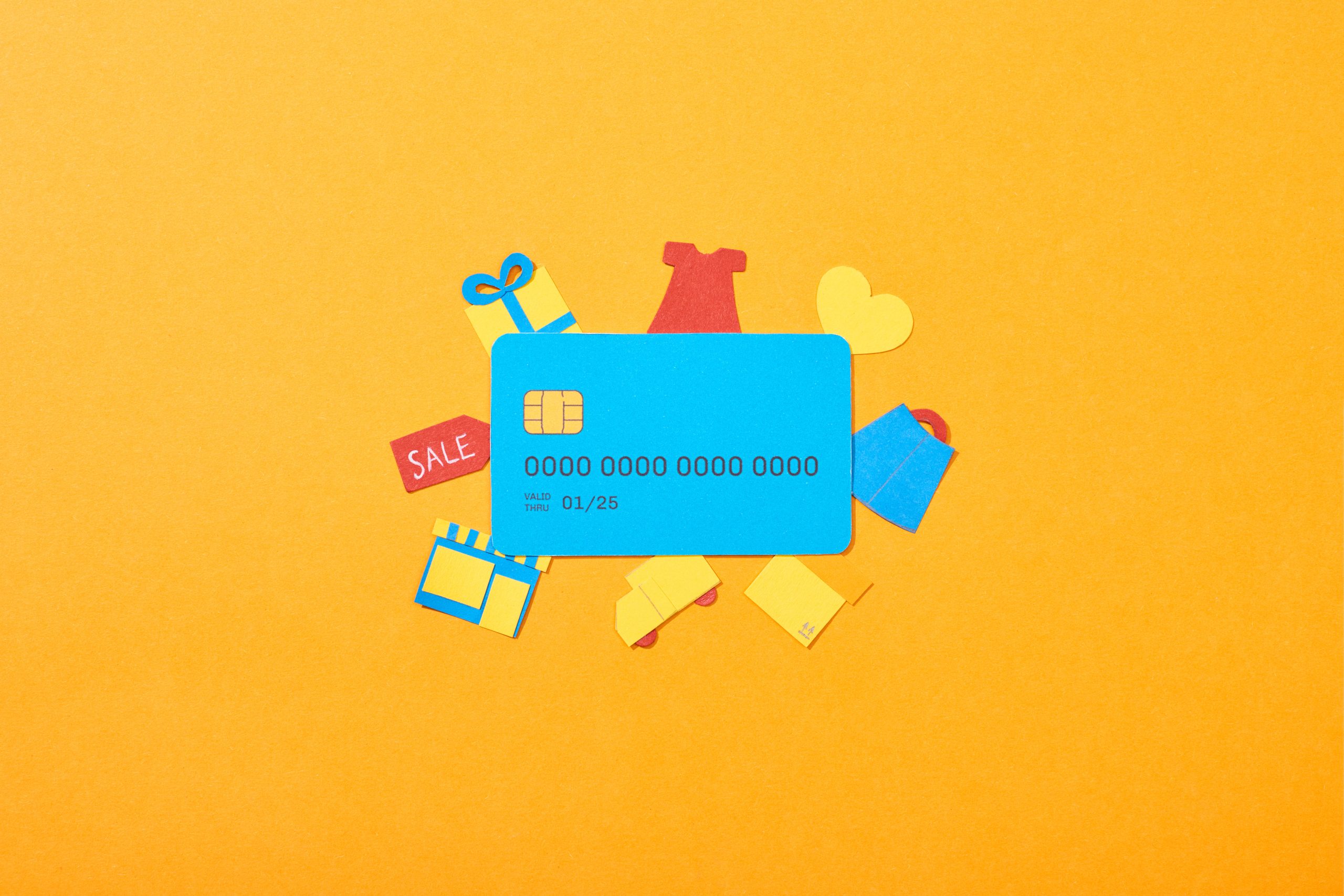 Customer Retention Strategies for B2B by showing a credit card and other gifts for clients